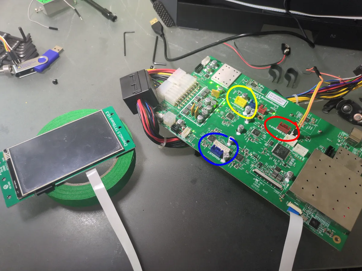 Motherboard removed with X, Y, and Z stepper output pins circled