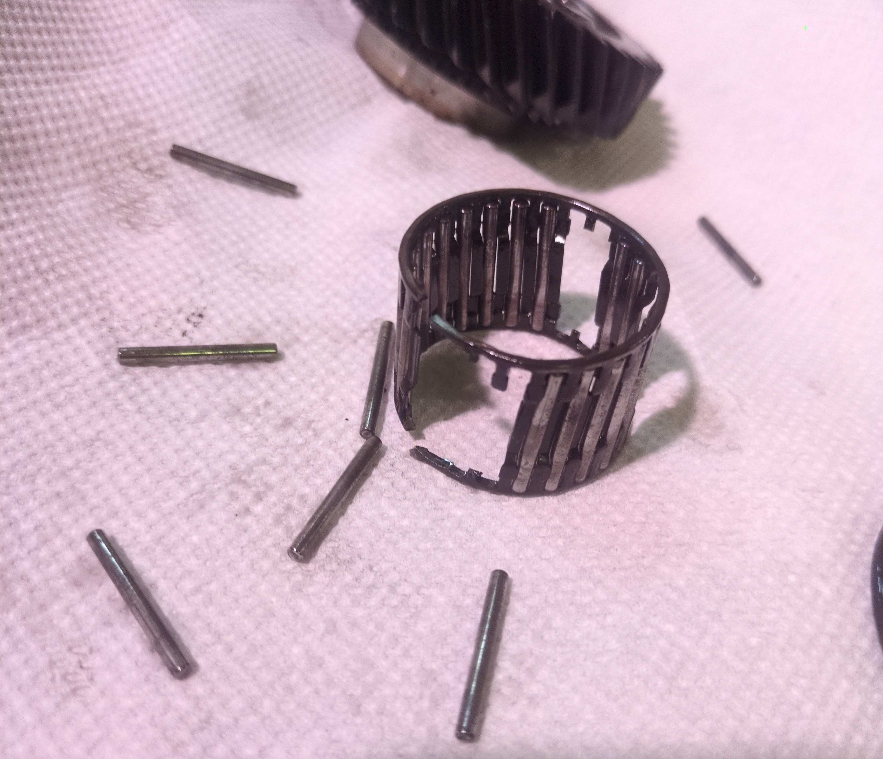 Broken pin bearing found during transmission reassembly