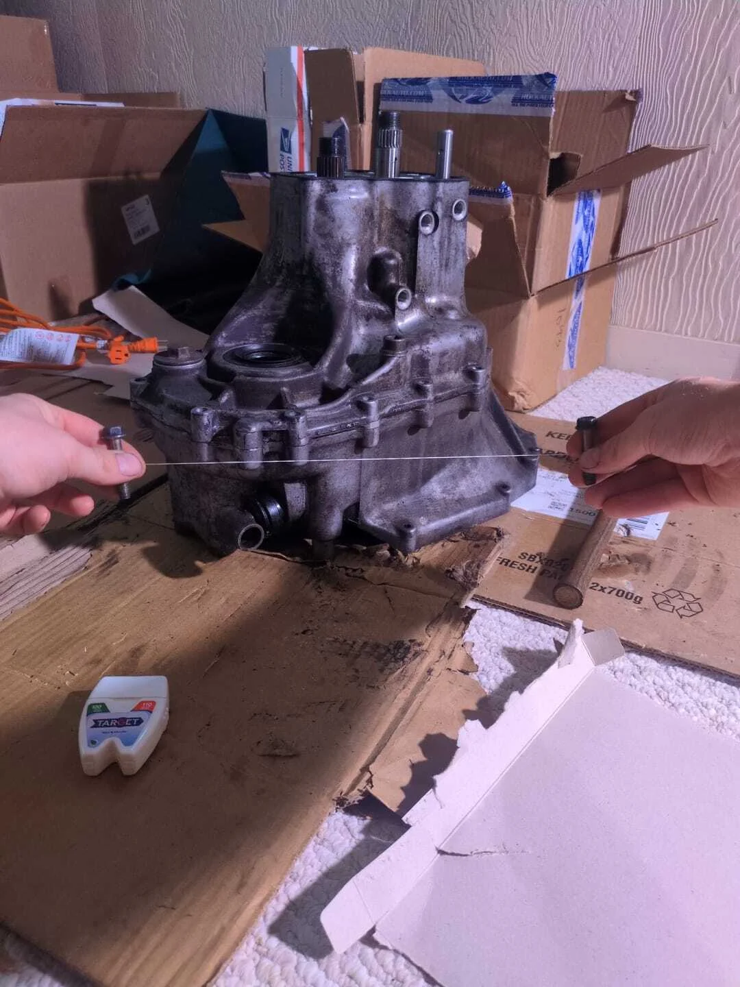 Struggling to pry open the aluminum transmission case